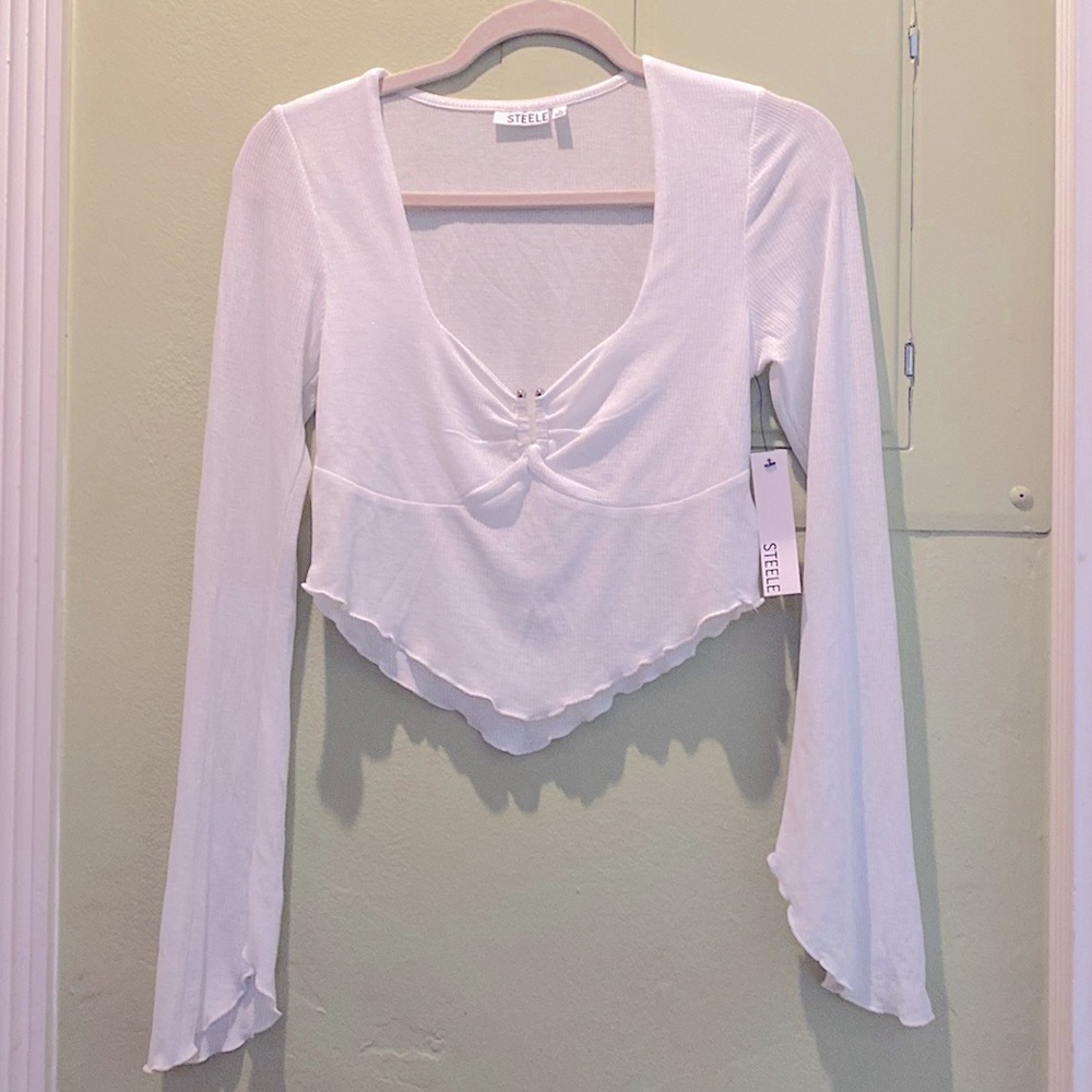 Brand new w tag Steele top with metal detail at chest center size S